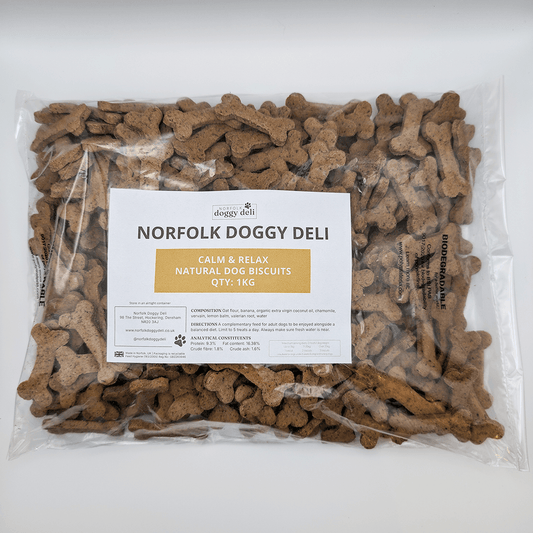 Package of Norfolk Doggy Deli dog biscuits with a label on a white background