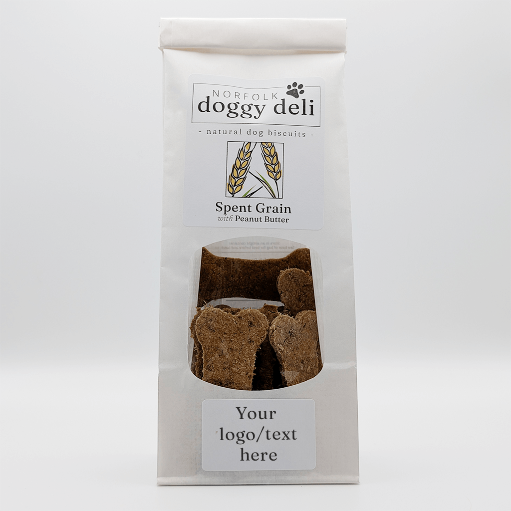 Package of Norfolk Doggy Deli spent grain with peanut butter dog biscuits on a white background