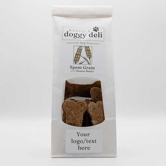 Package of Norfolk Doggy Deli spent grain with peanut butter dog biscuits on a white background